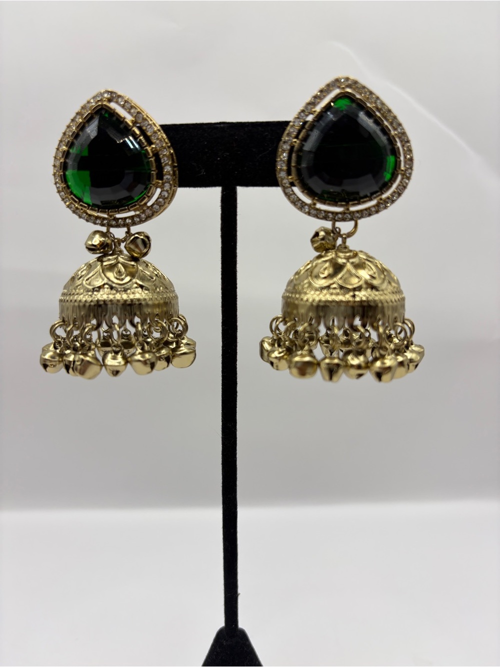 Gold Plated Brass Statement Jhumka Earrings with Green Teardrop Stone